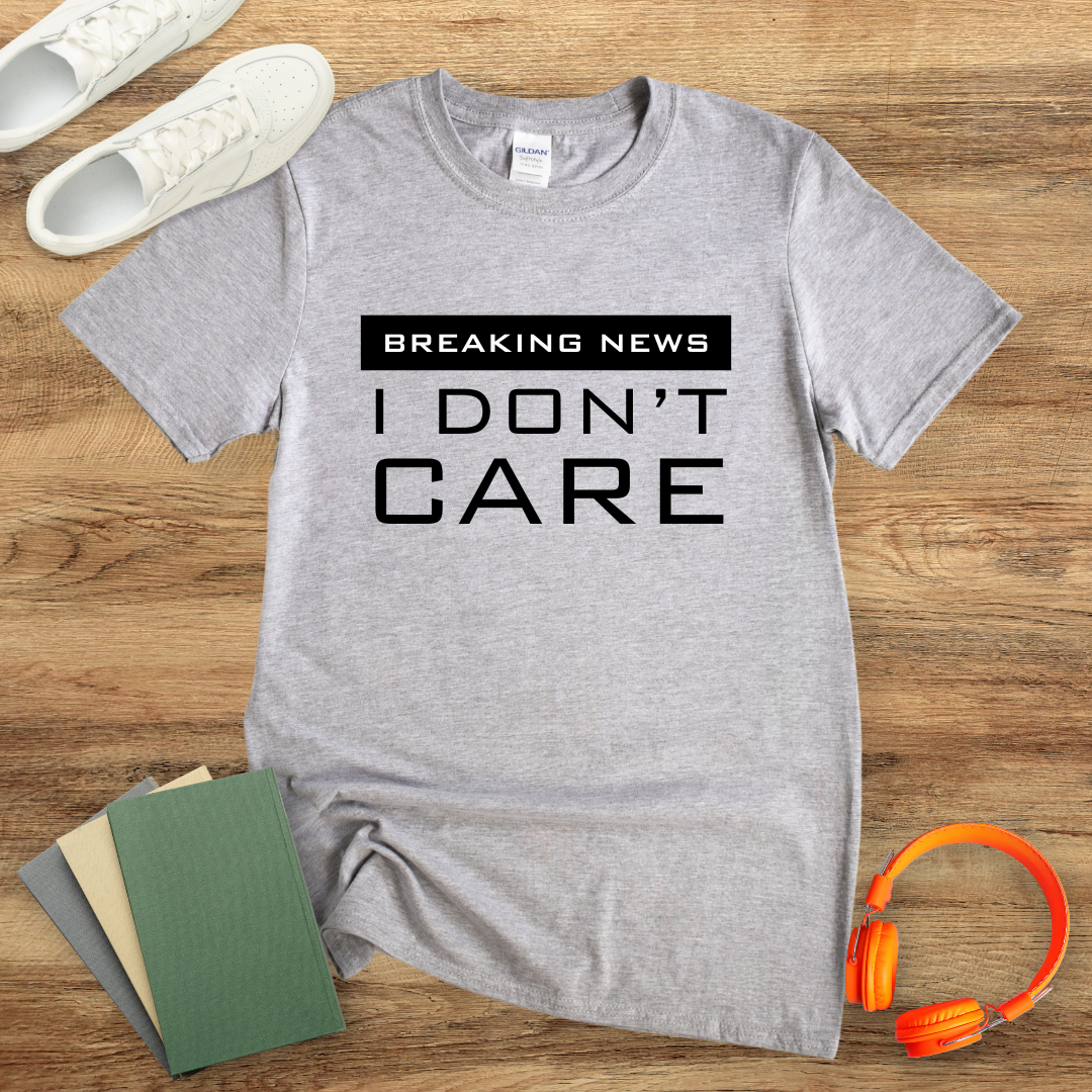 Breaking News, I Don't Care Unisex Softstyle T-Shirt